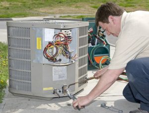 air-conditioning-technician-working-on-system