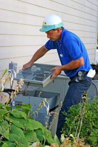 tech-working-on-air-conditioner