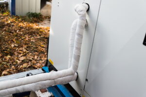 refrigerant-and-condensate-line-behind-air-conditioner